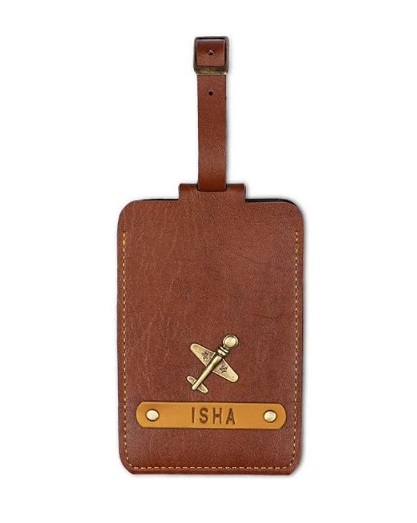The Junket Personalized Luggage Tag for Men & Women | Custom Engraved Name Tag with Charm | Premium Leather Travel Accessory | Raksha Bandhan Gift for Brother, Sister & Frequent Travelers (Tan)